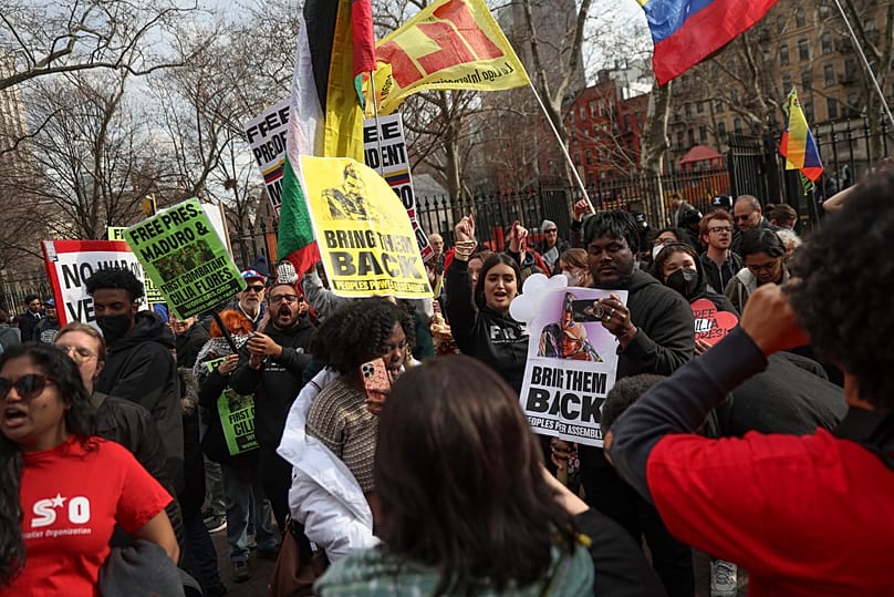 Demonstrators protest outside Manhattan federal court before a pre-trial hearing in former Venezuela President Nicolás Maduro's drug trafficking case, 26 March, 2026