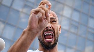 Andrew Tate speaks to media outside the Bucharest Tribunal after being placed under house arrest, 22 August, 2024