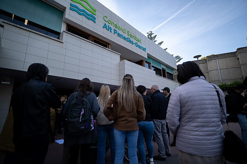 People gather outside a hospital where Noelia Castillo died after winning a long court fight for her right to euthanasia in Sant Pere de Ribes, 26 March, 2026