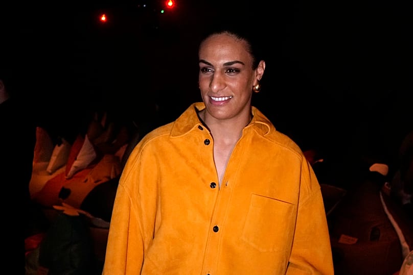 Algeria's Imane Khelif, Olympic gold medalist in the the women's 66kg boxing, smiles as she attends a Bottega Veneta fashion show, in Milan, Italy, Saturday, Sept. 21, 2024