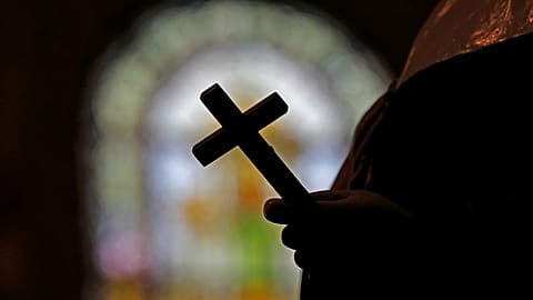 Image of a Catholic cross inside a church.