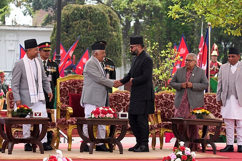 Nepal's youngest Prime Minister Balendra Shah shakes hand with president Ram Chandra Poudel after taking the oath of office in Kathmandu, 27 March, 2026