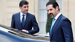 نائب رئيس الوزراء في حكومة إقليم كردستان قوباد طالباني، على اليمين، ورئيس وزراء إقليم كردستان العراق المتمتع بالحكم الذاتي نشيروان بارزاني، في الخلف