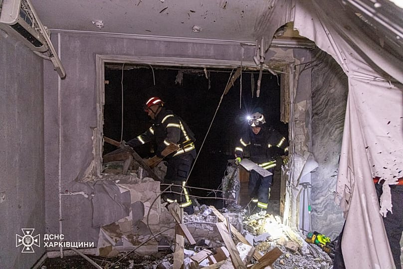 Firefighters put out a fire in a residential building following a Russian drone attack in Kharkiv, 27 March, 2026