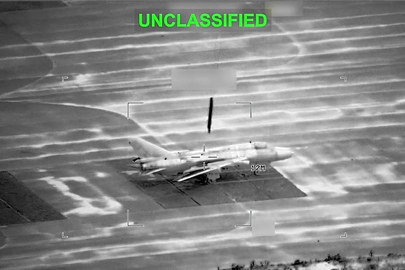 This partially redacted image from video provided by US Central Command shows a military aircraft in Iran shortly before it was struck by a US missile, Sunday, March 1, 2026