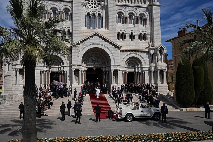 Pope Leo XIV leaves after meeting with the local Catholic community inside Monaco Cathedral in Monaco-Ville, Monaco, Saturday, March 28, 2026