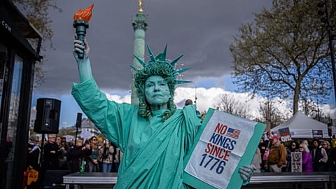 A woman dressed as the Statue of Liberty takes part in the "No Kings" protest in Paris, France, Saturday, 28 March, 2026.