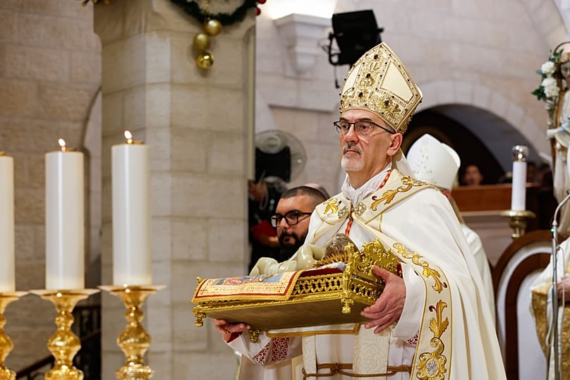 Latin Patriarch of Jerusalem Pierbattista Pizzaballa leads Christmas Eve Mass at the Church of the Nativity in Bethlehem, Israeli-occupied West Bank, Wednesday, Dec. 24, 2025