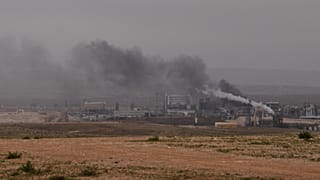 Smoke billows from an industrial zone in southern Israel after it was struck by an Iranian missile Sunday, March 29, 2026. 