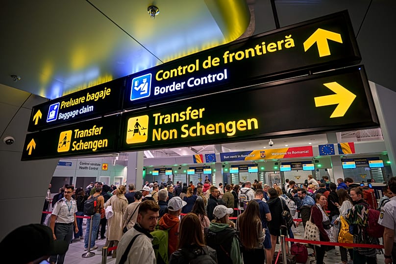 Passengers arriving at the Henri Coanda International Airport in Romania