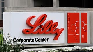 FILE: A sign for Eli Lilly & Co. stands outside their corporate headquarters.