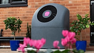 A heat pump located outside a house.