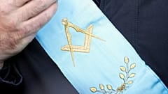 FILE: A French Freemason, wearing his lodge's scarf, looks on during a gathering of members of Masonic bodies near the French parliament in Paris, 10 December 2005