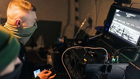 Soldiers of the 127th Separate Territorial Brigade operate a drone that searches for Russian attack drones at the front line in the Kharkiv region Saturday, March 14, 2026.