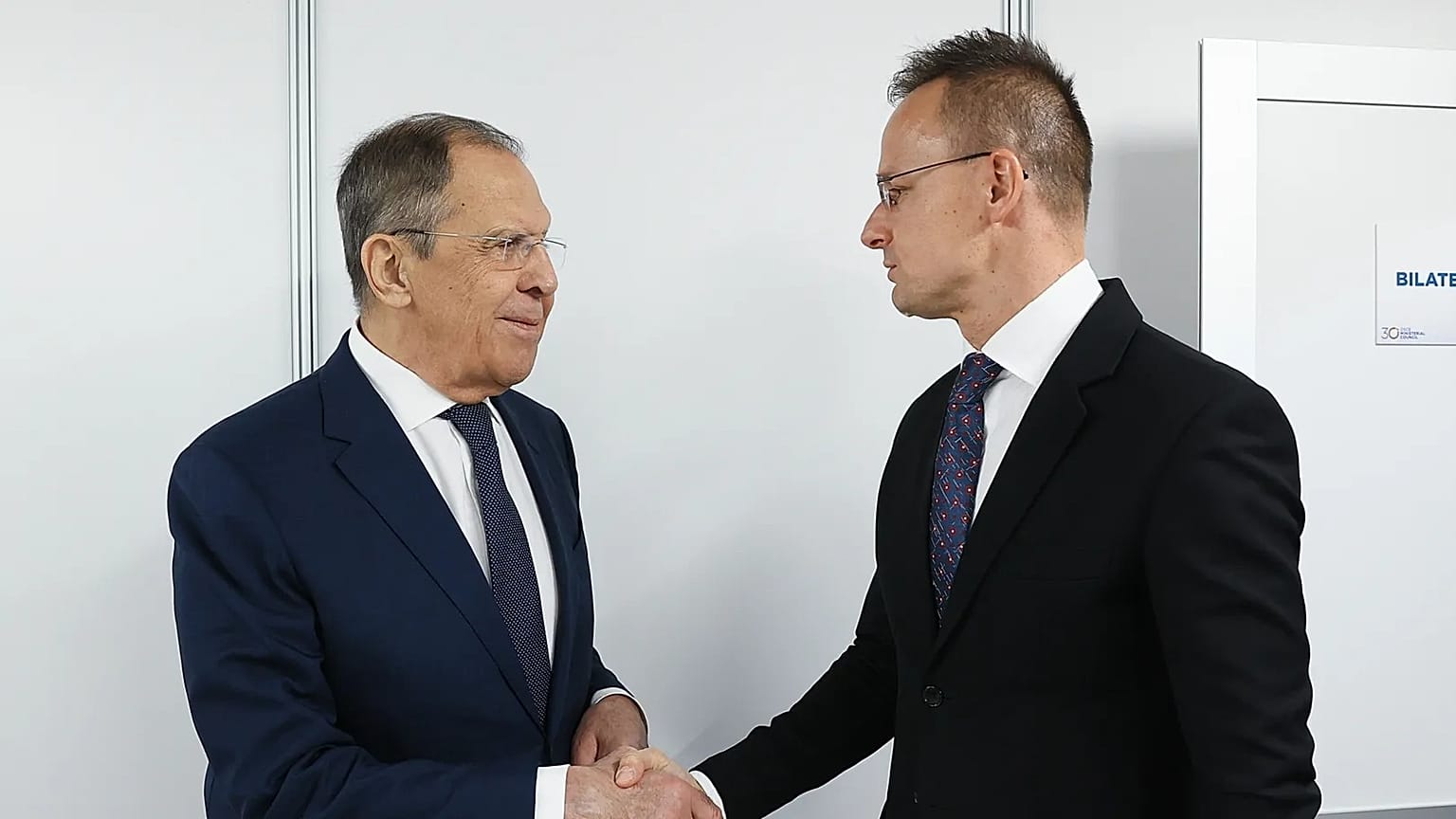  Russian Foreign Minister Sergey Lavrov, left, shakes hands with Hungarian Minister of Foreign Affairs and Trade Peter Szijjarto on the sidelines of the OSCE