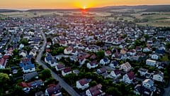 FILE: The sun rises over the city of Wehrheim near Frankfurt, Germany, Thursday, July 6, 2023.