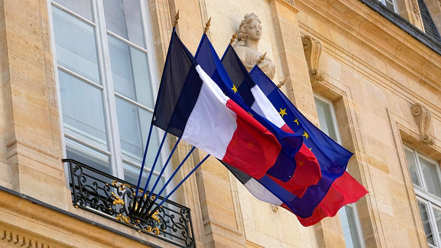 FILE - French and European flags float at the presidential Elysée palace during the weekly cabinet meeting, 20 April 2022 in Paris