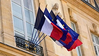 FILE - French and European flags float at the presidential Elysée palace during the weekly cabinet meeting, 20 April 2022 in Paris