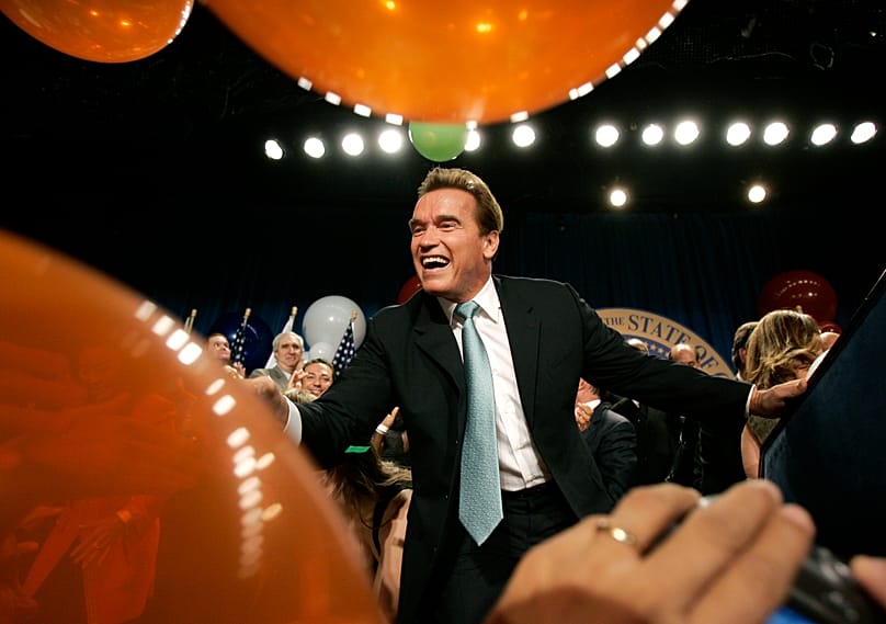 Governor Arnold Schwarzenegger shakes hands with supporters as he celebrates at his re-election victory party in Beverly Hills, Nov. 7, 2006 (AP Photo/Kevork Djansezian)