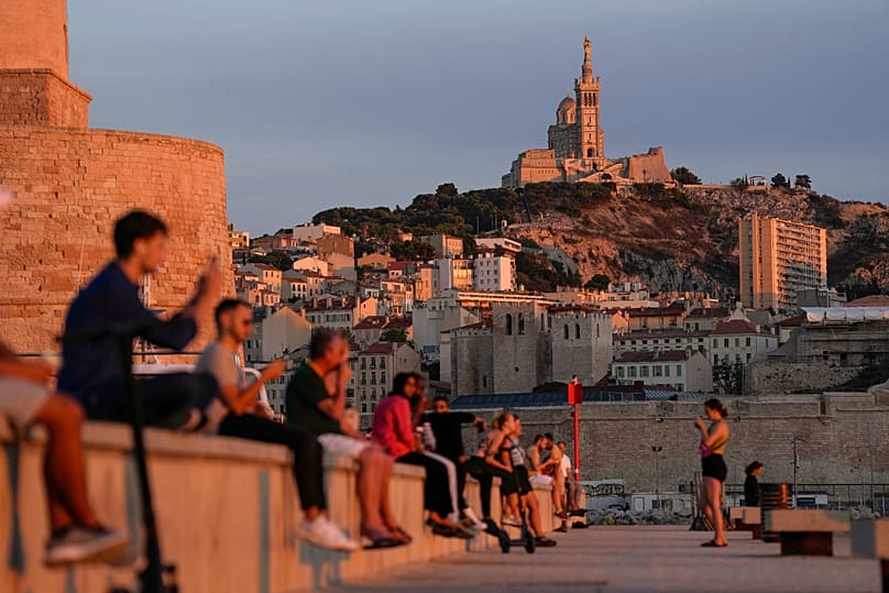 The Notre Dame de la Garde Basilica is seen on a top of the hill during a sunset in Marseille, 19 September, 2023