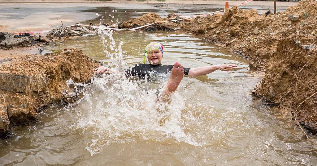 South African politician takes dip in pothole to show city management failures