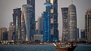 FILE - A traditional dhow boat sails towards the West Bay in Doha, Qatar