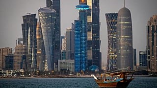 FILE - A traditional dhow boat sails towards the West Bay in Doha, Qatar