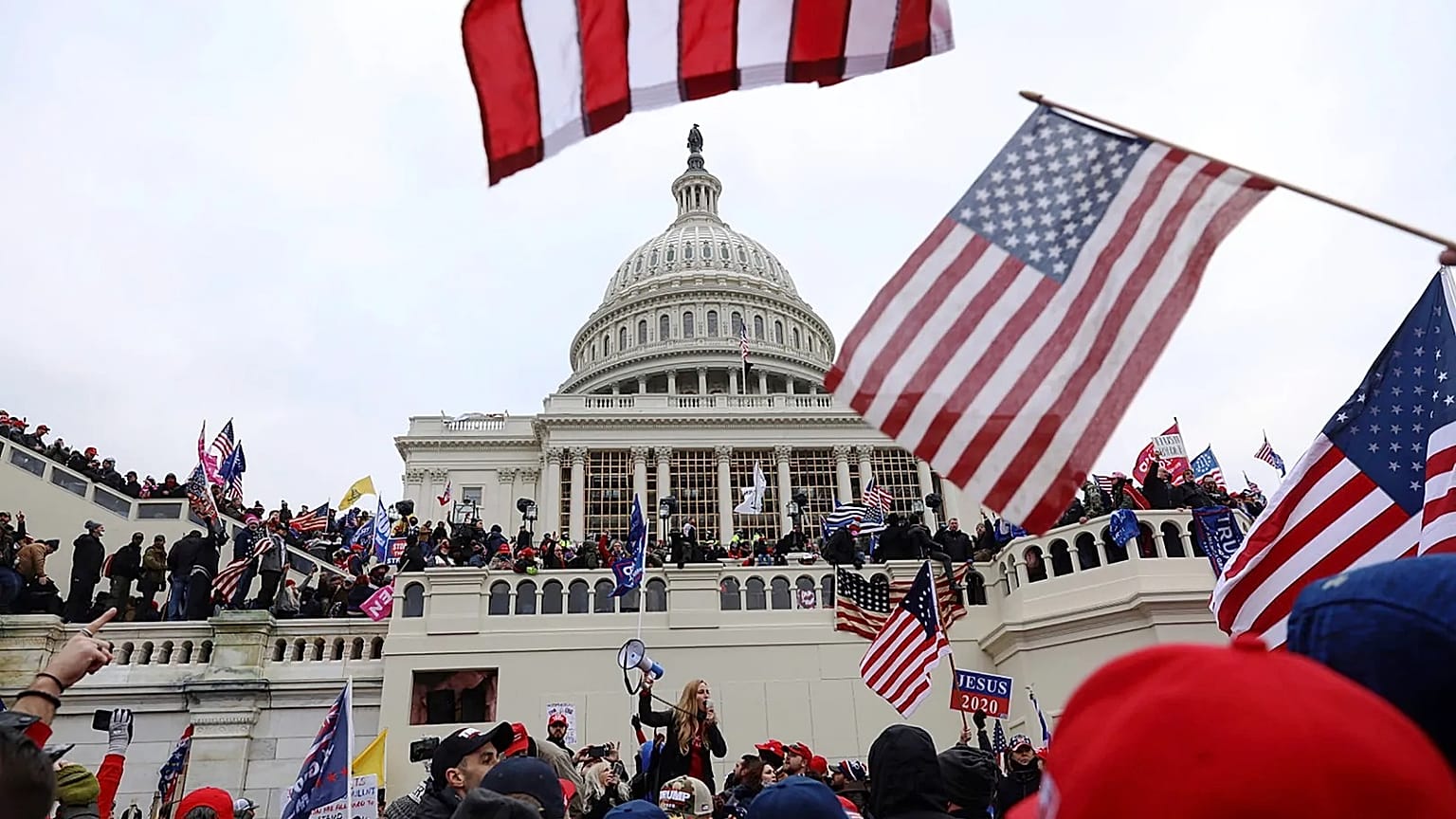 Supporters of President Donald Trump are confronted by US Capitol Police officers outside the Capitol, 6 January, 2021