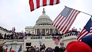 Supporters of President Donald Trump are confronted by US Capitol Police officers outside the Capitol, 6 January, 2021