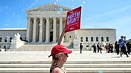 Demonstrators rally outside the US Supreme Court in Washington, 1 April, 2026