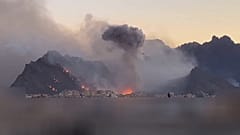 A plume of smoke rises after a strike in Isfahan, Iran, April 1, 2026.