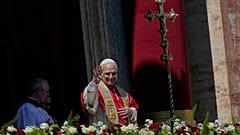 Pope Leo XIV addresses the faithful from the central loggia of St. Peter's Basilica at the Vatican on Sunday 5 April 2026.