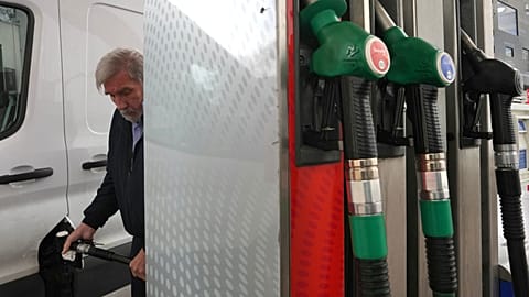 A man fills his car with diesel at a gas station in London, Monday, March 30, 2026. 