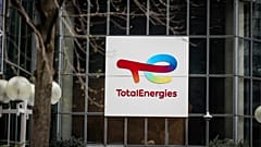  A sign for French company TotalEnergies is displayed 21 March, 2025, in La Defense business district outside Paris. 