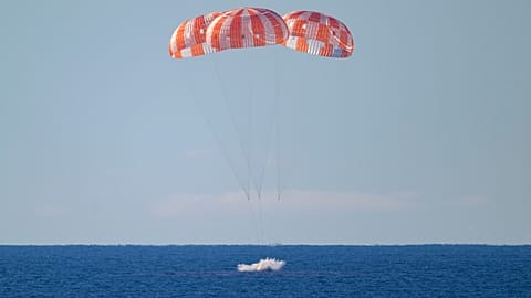 In this photo provided by NASA, the Orion spacecraft with Artemis II crewmembers aboard splashes down in the Pacific Ocean off the coast of California, Friday, April 10, 2026.