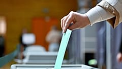 A woman casts her ballot at a polling station during the Hungarian parliamentary election in Budapest, Hungary, Sunday, April 12, 2026. (AP Photo/Denes Erdos)
