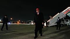 President Donald Trump walks to speak with reporters after disembarking Air Force One, Sunday, April 12, 2026