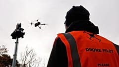 A drone operator flies a drone during a demonstration of a mobile counter drone system in Geel, 2 December, 2025