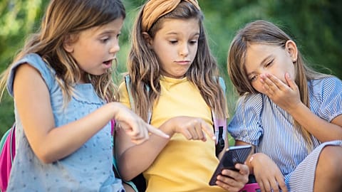 Children looking at a smartphone