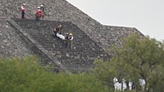Forensic workers carry the body of a victim down a pyramid after authorities said a gunman opened fire, in Teotihuacan, Mexico, Monday, April 20, 2026