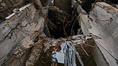 A portrait of late Hezbollah leader placed on a destroyed building in Beirut, 20 April, 2026