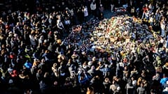 People gather during a memorial procession in Crans-Montana, 4 January, 2026