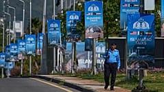 A police officer walks past billboards near the Serena Hotel ahead of the second round of negotiations between the US and Iran in Islamabad, 21 April, 2026