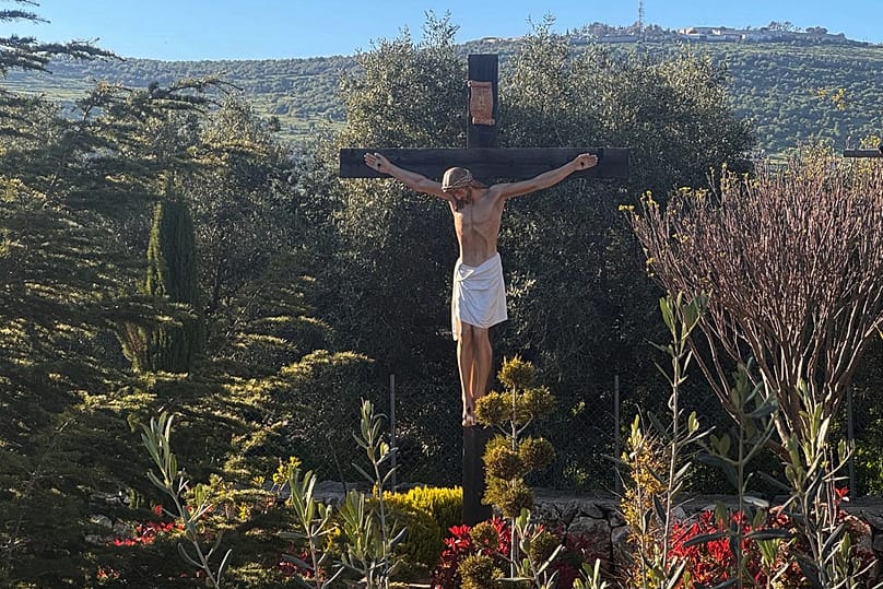A new crucifix that was sent by Italy to replace the one that was defaced last week by an Israeli soldier stands in the Christian village of Debel, 22 April, 2026