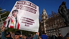 A campaigner holds a banner outside parliament in London as a proposed law to legalise assisted dying in England and Wales ran out of time, 24 April, 2026