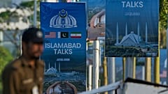 A police officer walks past posters of U.S. and Iran talks near a possible venue in Islamabad, Pakistan, Saturday, 25 April, 2026.