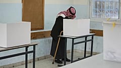 A Palestinian man votes in local elections in Al-Ubaidiya, West Bank, Saturday, April 25, 2026. 