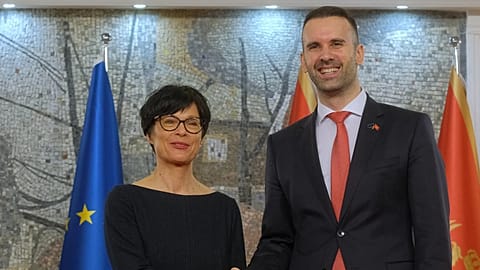 European Commissioner for Enlargement Marta Kos, left, shakes hands with Montenegro Prime Minister Milojko Spajic in Podgorica, Montenegro, Thursday, 26 March, 2026.
