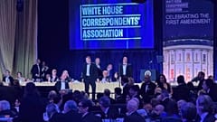 Agents surround Trump as he is taken from the stage after a shooting incident outside the ballroom during the White House Correspondents' Dinner. April 25, 2026, Washington.