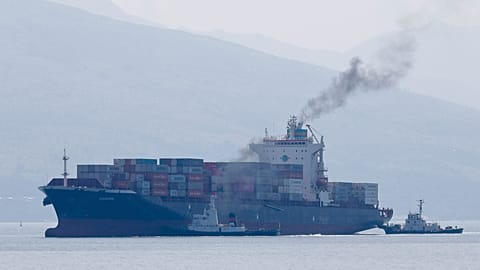  Cargo ship M/V Bavaria is assisted by tug boats as it prepares to dock at Subic port in Zambales province, northwestern Philippines on Thursday, May 30, 2019.